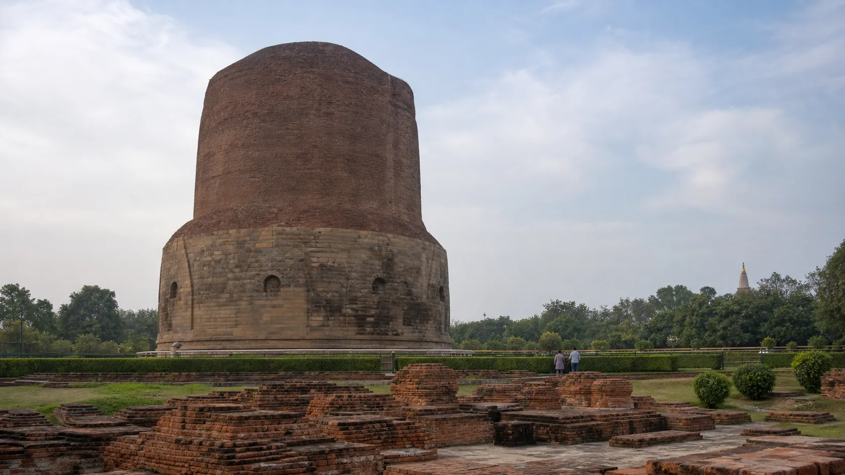 Dhamek Stupa and the archaeological landscape at Sarnath near Varanasi in soft morning light