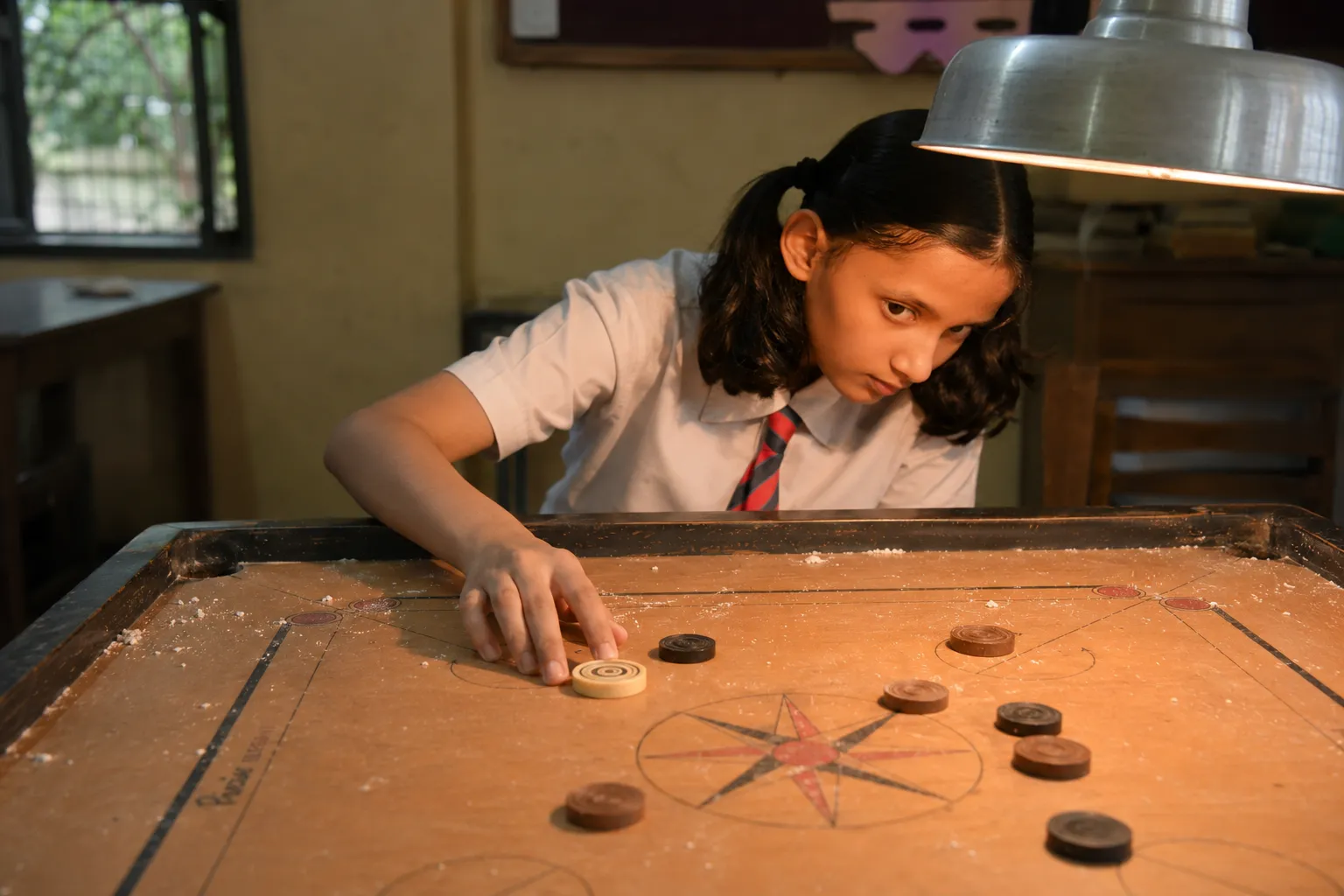 What Carrom Teaches Young Children About Focus, Patience and Thinking Ahead