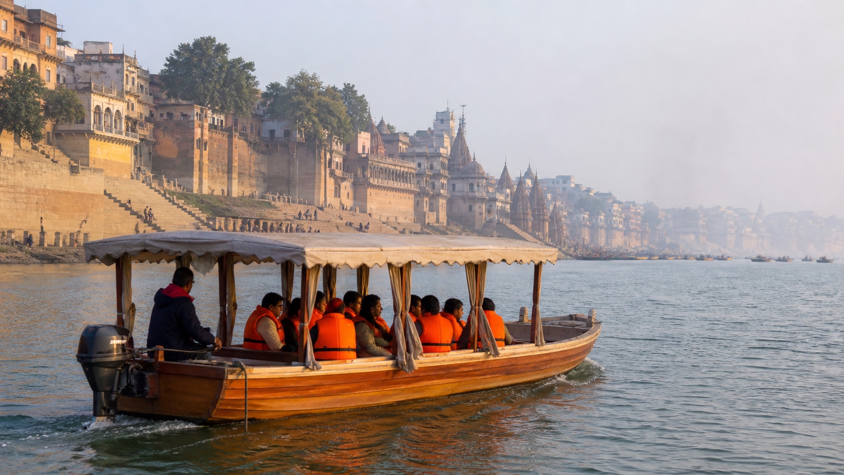 A quiet electric passenger boat moving between Varanasi ghats