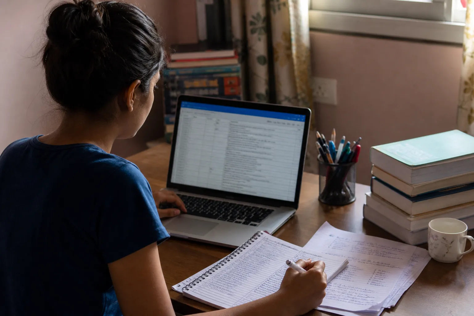 Medical aspirant reviewing an online college preference list on a laptop
