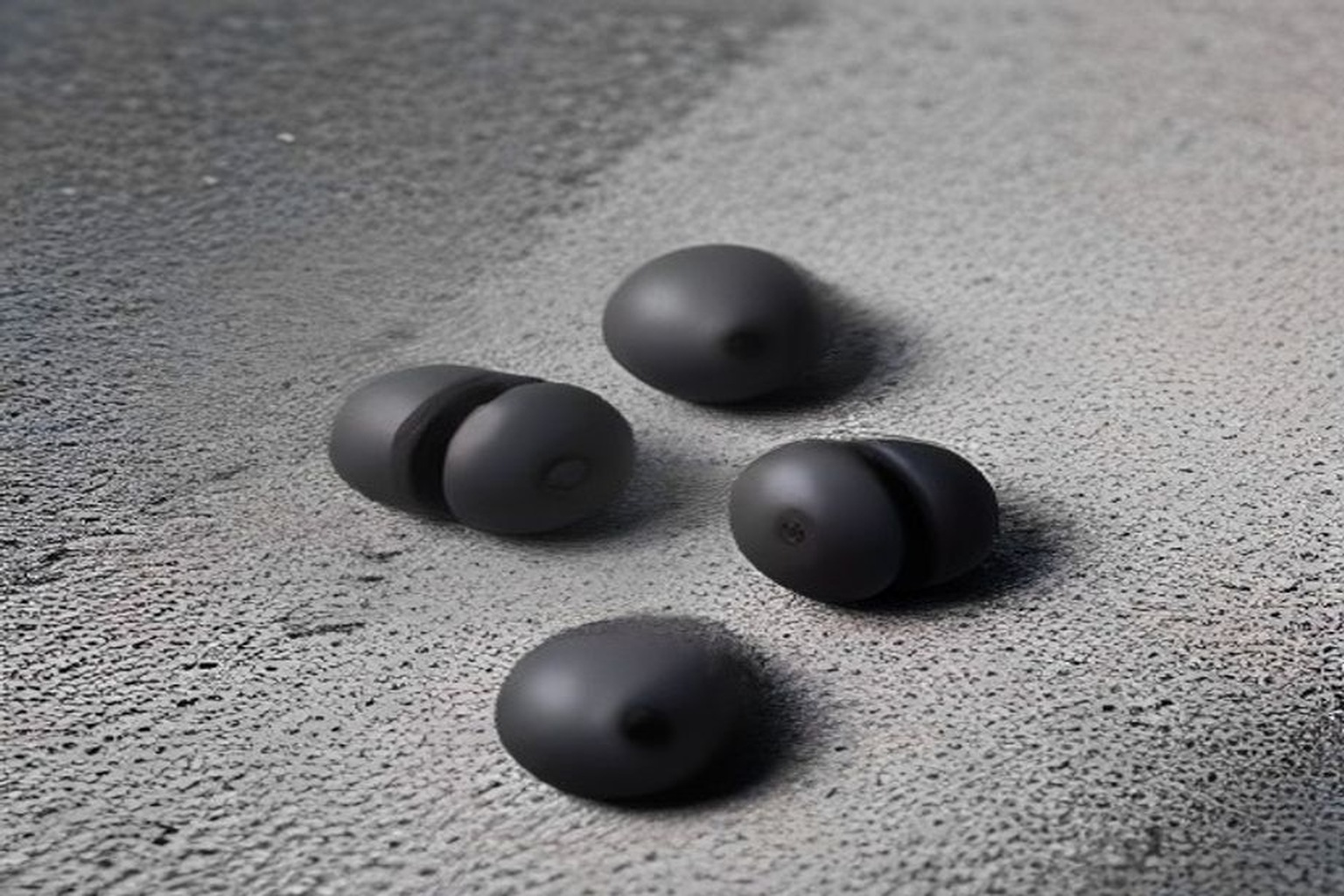 Representational illustration of wireless earbuds on a neutral desk surface