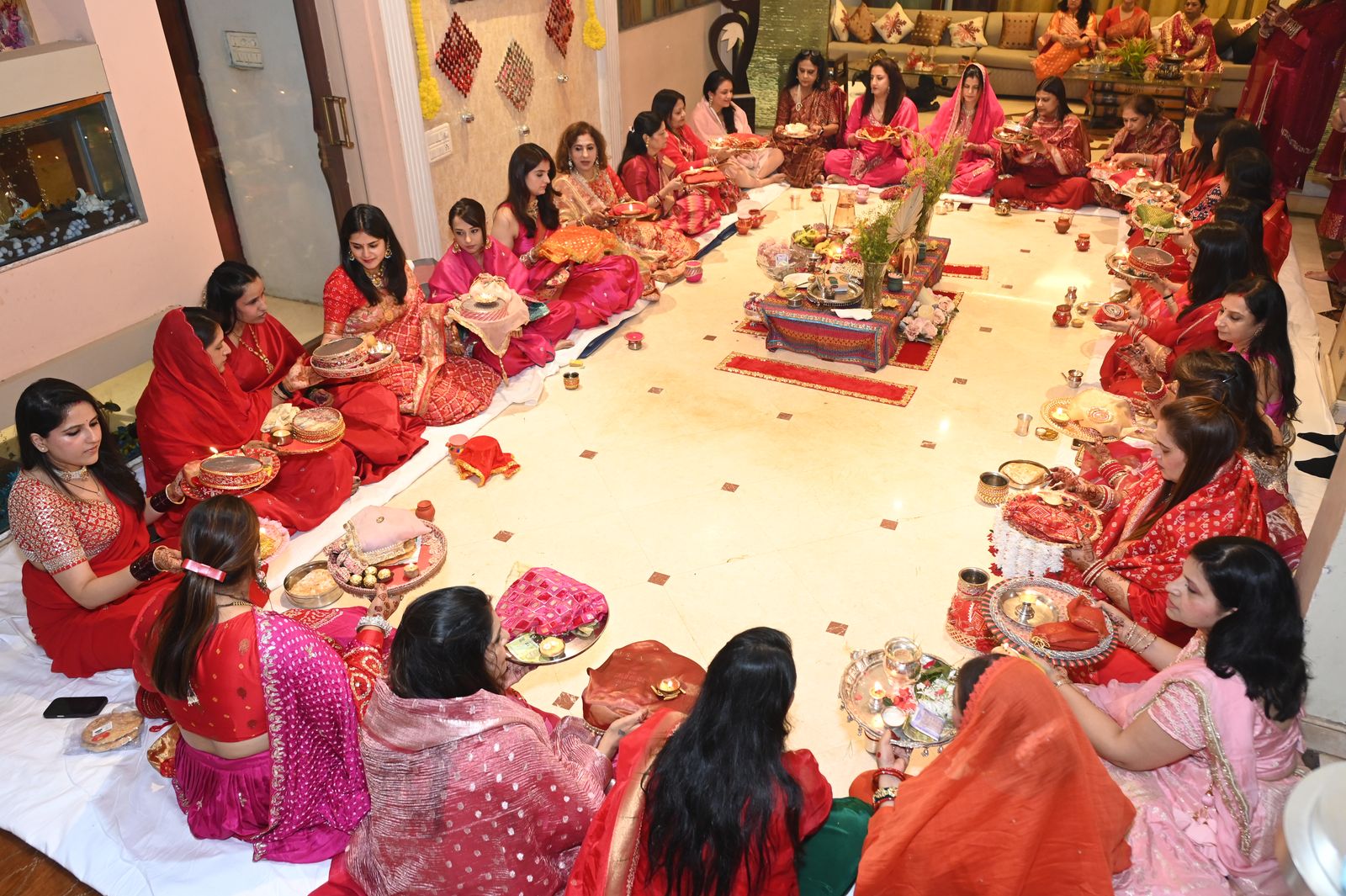 Guests seated together at the Karwa Chauth get-together Karwa Chauth get-together, Varanasi