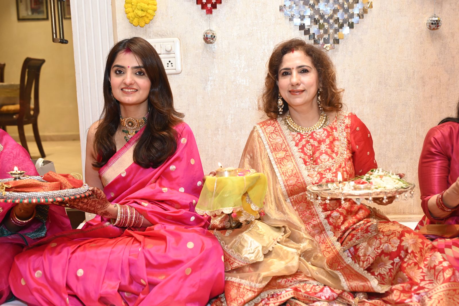Guests with their puja thalis Karwa Chauth get-together, Varanasi