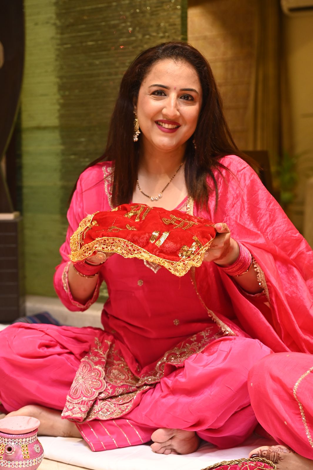 A guest with her puja thali, Karwa Chauth get-together, Varanasi