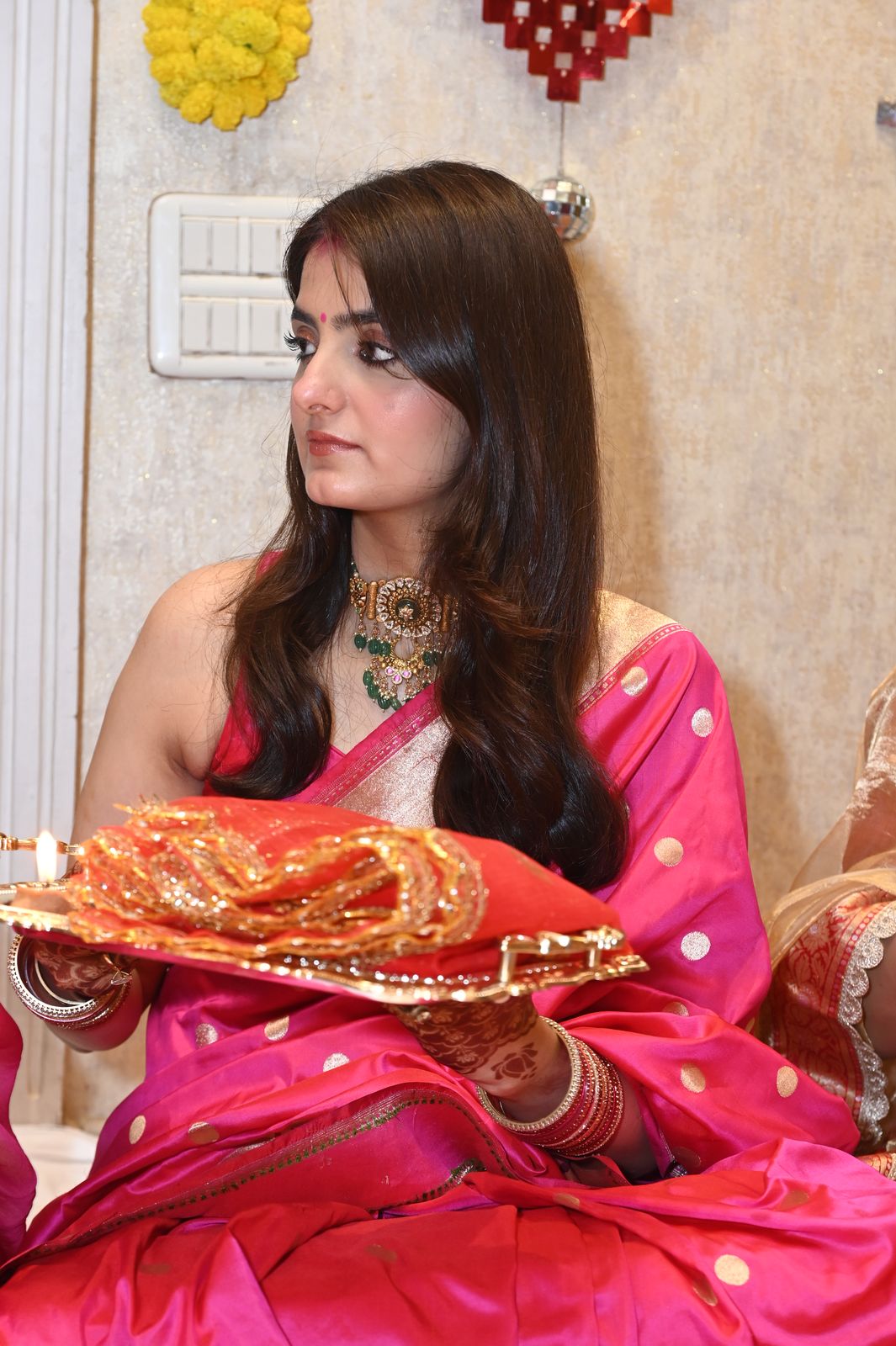 A guest with her puja thali, Karwa Chauth get-together, Varanasi