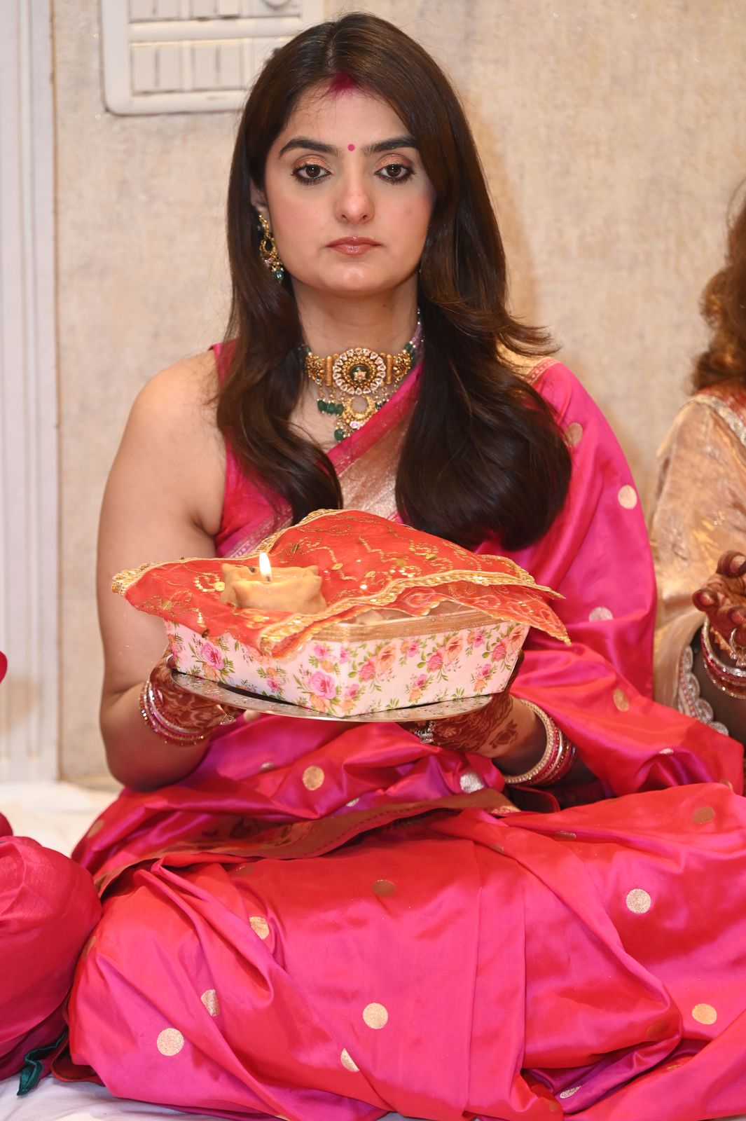 A guest with her puja thali, Karwa Chauth get-together, Varanasi