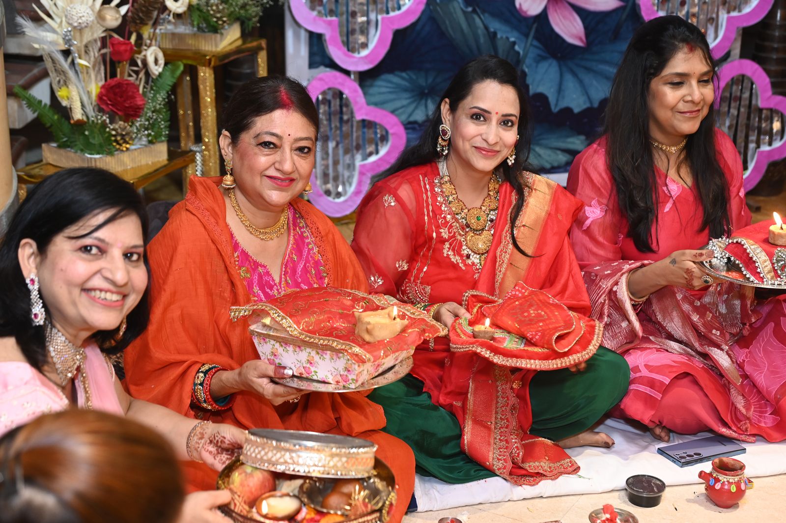 Guests share a moment during the gathering, Karwa Chauth get-together, Varanasi